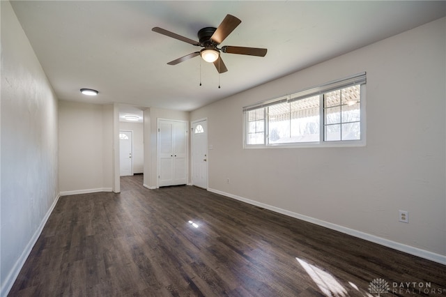 5027 Hackett Dr, Dayton, OH 45417 - unfurnished living room with dark wood-type flooring, a ceiling fan, and baseboards