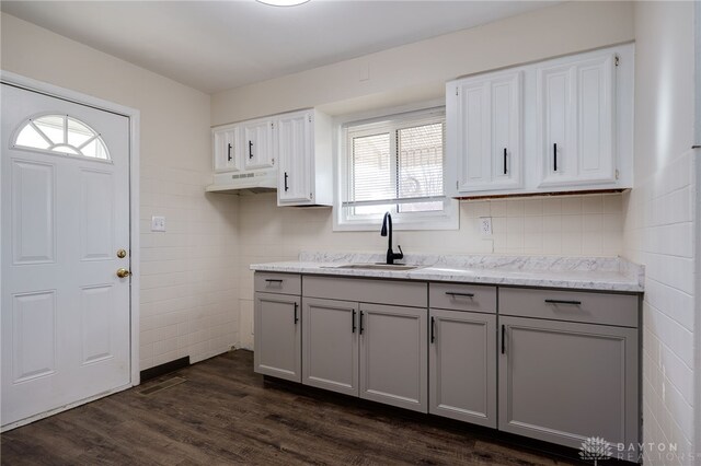 5027 Hackett Dr, Dayton, OH 45417 - kitchen with a sink, gray cabinets, dark wood-type flooring, white cabinets, and light stone countertops