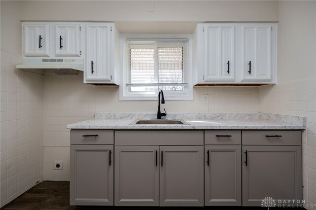 5027 Hackett Dr, Dayton, OH 45417 - kitchen with a sink, tile walls, gray cabinets, white cabinetry, and dark wood-style flooring