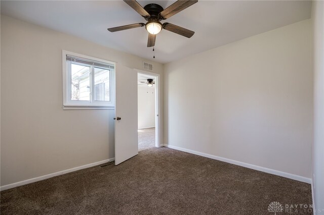 5027 Hackett Dr, Dayton, OH 45417 - spare room with carpet, a ceiling fan, and baseboards