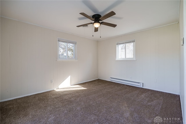 5027 Hackett Dr, Dayton, OH 45417 - spare room with baseboard heating, a ceiling fan, carpet flooring, and crown molding