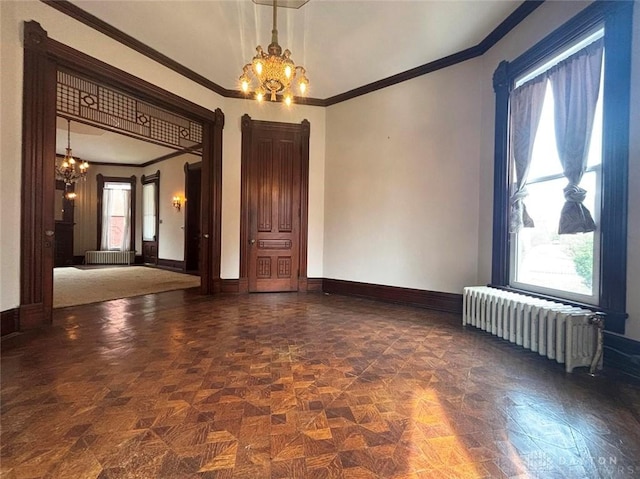 unfurnished room featuring baseboards, radiator heating unit, and an inviting chandelier