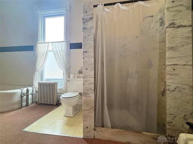 bathroom featuring a wealth of natural light, a shower with curtain, toilet, and radiator heating unit