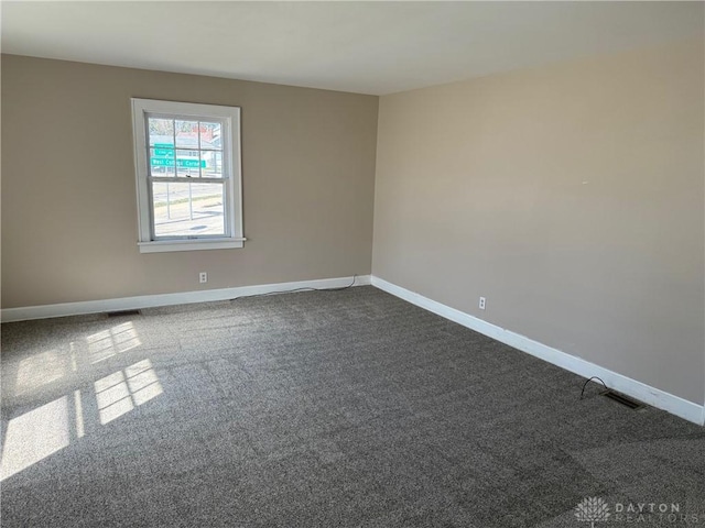 2 County Line Rd, College Corner, OH 45003 - empty room with baseboards, visible vents, and dark carpet