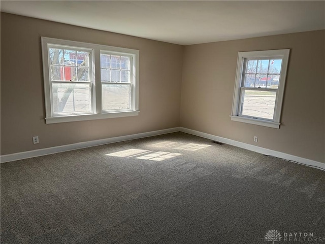 2 County Line Rd, College Corner, OH 45003 - empty room featuring visible vents, baseboards, and dark carpet