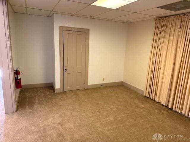 2 County Line Rd, College Corner, OH 45003 - empty room featuring a drop ceiling, baseboards, and light colored carpet
