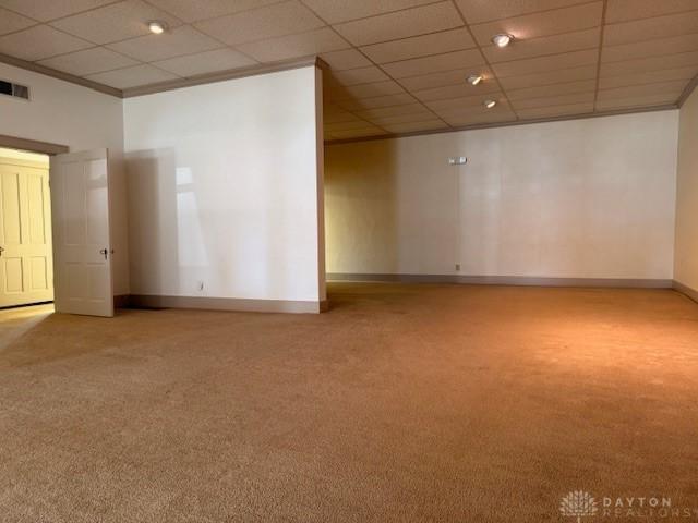 2 County Line Rd, College Corner, OH 45003 - carpeted spare room featuring ornamental molding, baseboards, visible vents, and a paneled ceiling
