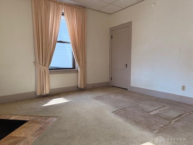 2 County Line Rd, College Corner, OH 45003 - empty room featuring a drop ceiling, baseboards, and carpet flooring