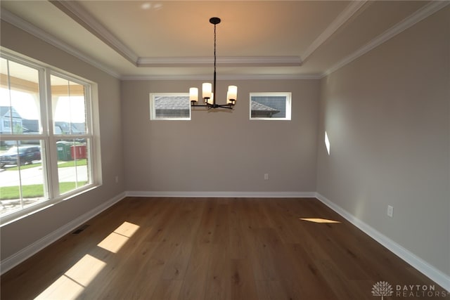 2855 Sky Crossing Dr Unit 50, Beavercreek, OH 45434 - empty room featuring a tray ceiling, a chandelier, dark wood finished floors, and crown molding
