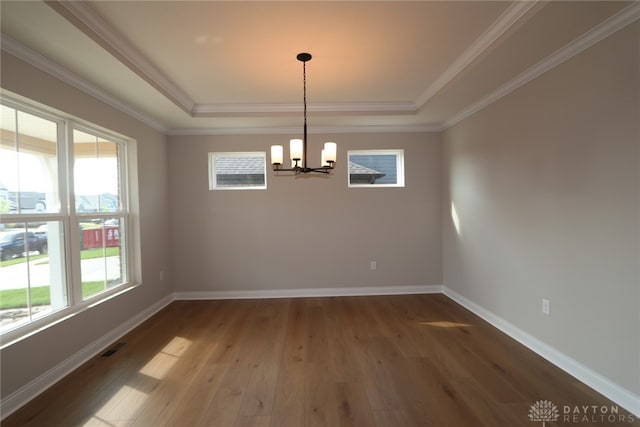 2855 Sky Crossing Dr Unit 50, Beavercreek, OH 45434 - spare room featuring a tray ceiling, a chandelier, wood finished floors, and ornamental molding