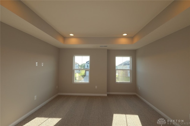 2855 Sky Crossing Dr Unit 50, Beavercreek, OH 45434 - empty room with a tray ceiling, recessed lighting, and light colored carpet