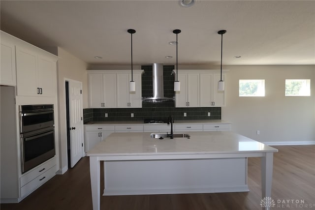 2855 Sky Crossing Dr Unit 50, Beavercreek, OH 45434 - kitchen featuring wall chimney exhaust hood, double oven, dark wood finished floors, and recessed lighting