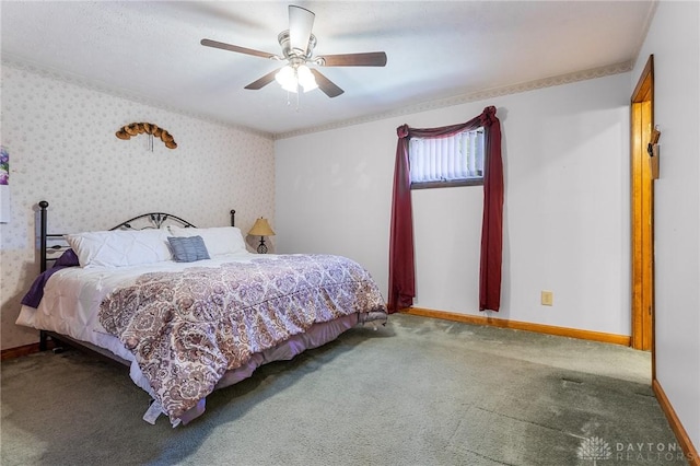 carpeted bedroom featuring a ceiling fan and baseboards