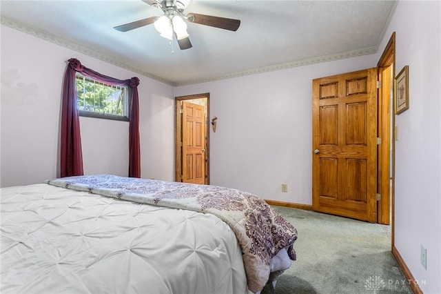 carpeted bedroom with baseboards and ceiling fan