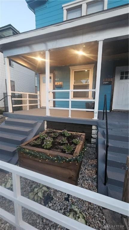 entrance to property with covered porch
