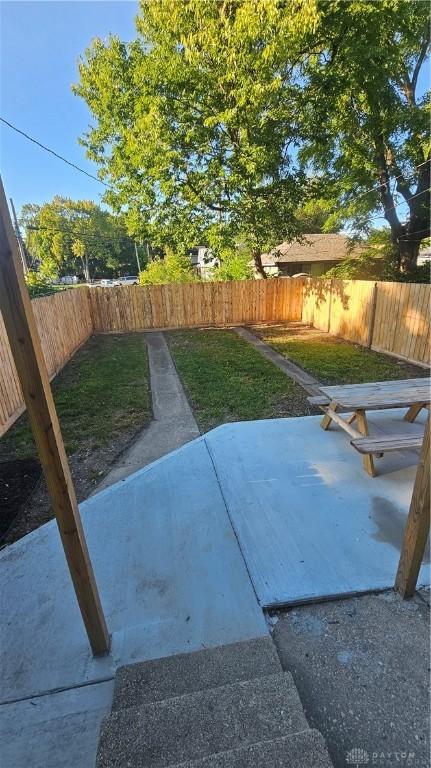 view of yard featuring a patio area and a fenced backyard