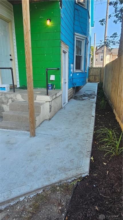 view of patio featuring fence