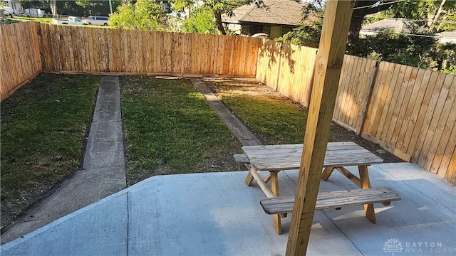 view of yard featuring a patio area and a fenced backyard