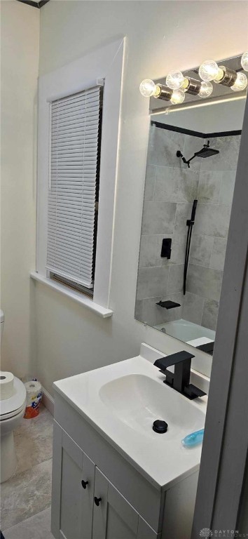 bathroom featuring toilet and vanity
