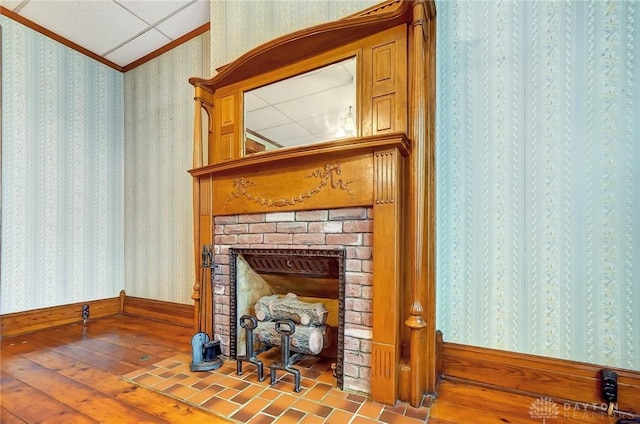 322 Hickory St, Dayton, OH 45410 - details with a brick fireplace, wood finished floors, crown molding, and wallpapered walls