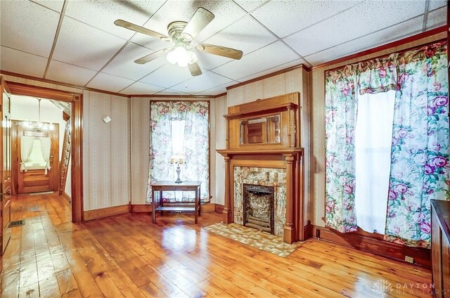 322 Hickory St, Dayton, OH 45410 - living area with light wood finished floors, visible vents, a fireplace, and a ceiling fan