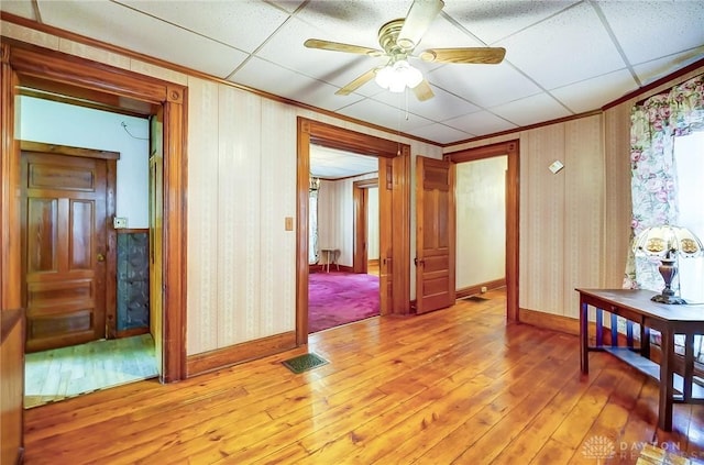 322 Hickory St, Dayton, OH 45410 - unfurnished room featuring wallpapered walls, visible vents, a ceiling fan, and light wood finished floors