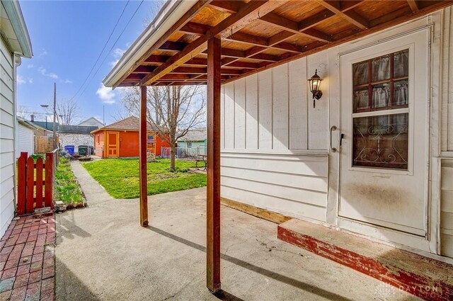 322 Hickory St, Dayton, OH 45410 - view of patio featuring an outbuilding and fence