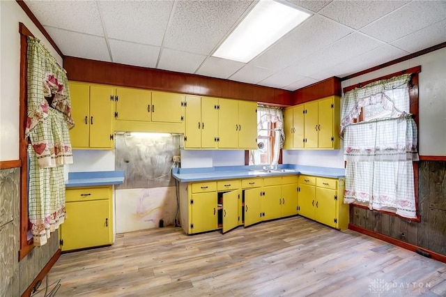 322 Hickory St, Dayton, OH 45410 - kitchen with light wood finished floors, a drop ceiling, and yellow cabinets