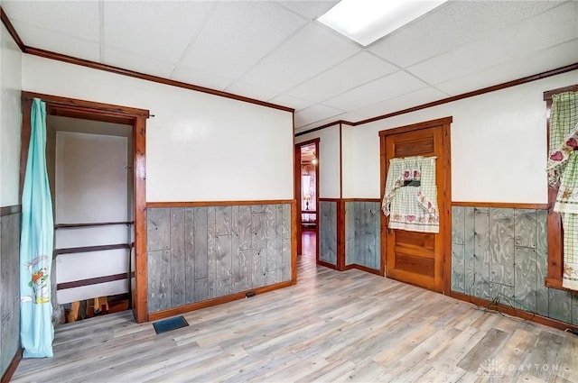 322 Hickory St, Dayton, OH 45410 - spare room with a wainscoted wall, visible vents, a drop ceiling, wood finished floors, and crown molding