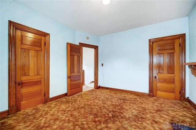 322 Hickory St, Dayton, OH 45410 - unfurnished bedroom featuring baseboards and carpet flooring