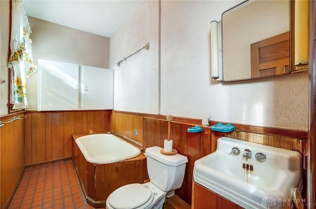 322 Hickory St, Dayton, OH 45410 - bathroom featuring toilet, a wainscoted wall, and wood walls