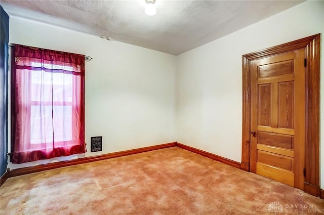 322 Hickory St, Dayton, OH 45410 - carpeted empty room featuring visible vents, baseboards, and a textured ceiling