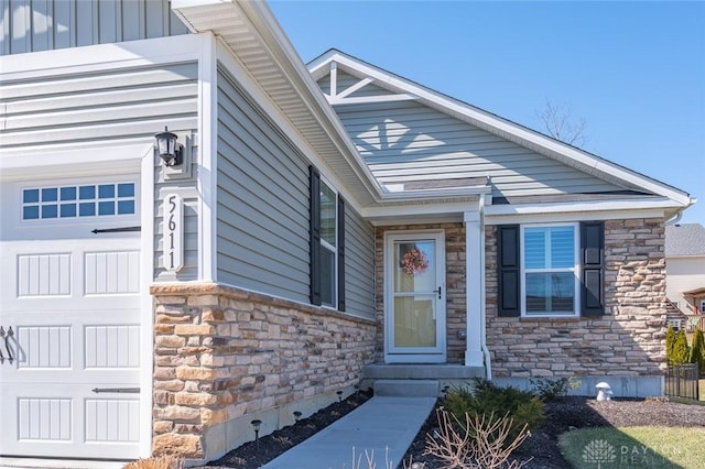entrance to property featuring stone siding and crawl space