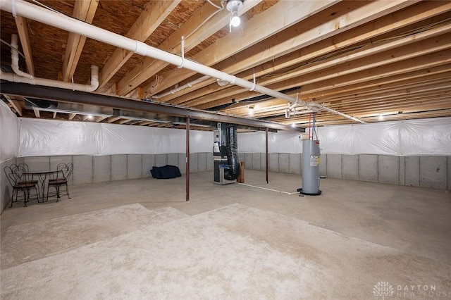 unfinished below grade area with heating unit and water heater