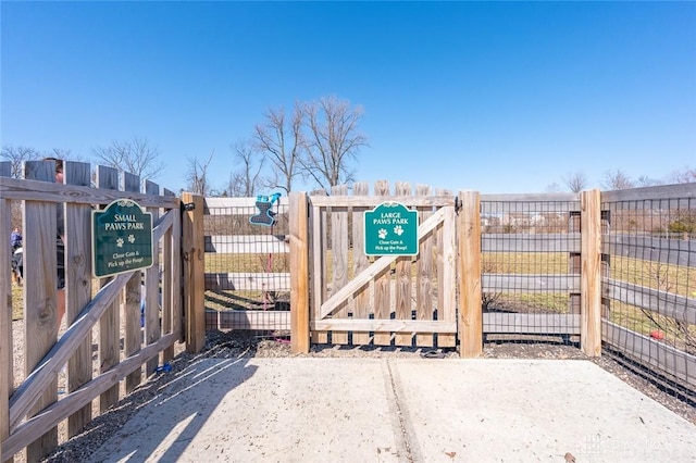 view of gate with fence