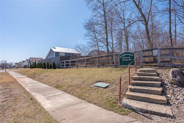 view of property's community featuring fence