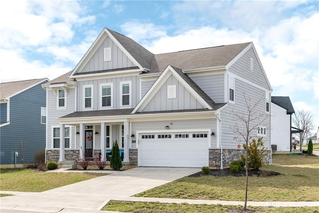 2012 Prestwick Bnd, Miamisburg, OH 45342 - craftsman-style house with a front yard, a porch, concrete driveway, stone siding, and board and batten siding
