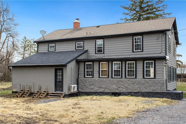4385 N Hyland Ave, Dayton, OH 45424 - rear view of house featuring entry steps, a shingled roof, and a chimney