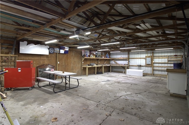 4385 N Hyland Ave, Dayton, OH 45424 - miscellaneous room with electric panel, a garage, and unfinished concrete floors