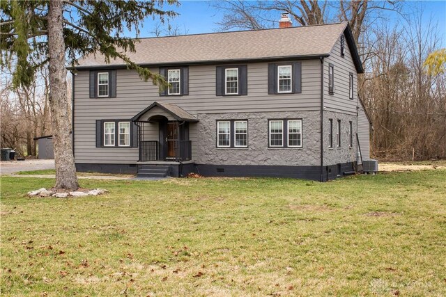 4385 N Hyland Ave, Dayton, OH 45424 - colonial inspired home featuring a front lawn, a chimney, central AC, and crawl space