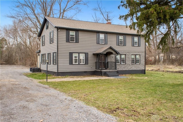 4385 N Hyland Ave, Dayton, OH 45424 - colonial house featuring a front yard, roof with shingles, driveway, a chimney, and crawl space