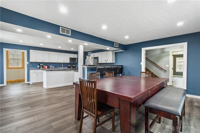 4385 N Hyland Ave, Dayton, OH 45424 - dining room featuring recessed lighting, wood finished floors, visible vents, and baseboards