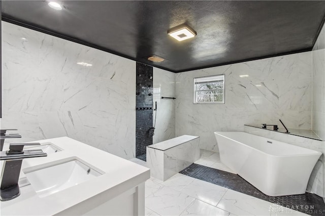 4385 N Hyland Ave, Dayton, OH 45424 - bathroom with stone wall, a soaking tub, a sink, walk in shower, and marble finish floor