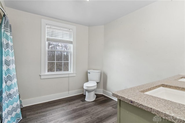 4385 N Hyland Ave, Dayton, OH 45424 - full bathroom with curtained shower, baseboards, toilet, wood finished floors, and vanity
