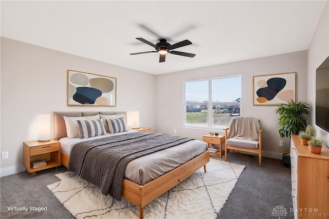 carpeted bedroom with baseboards and a ceiling fan