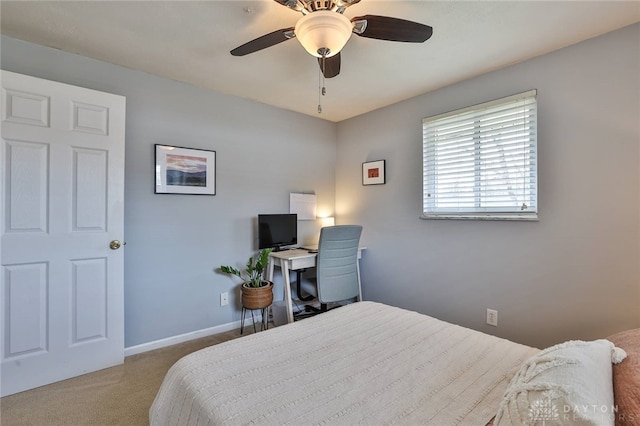 bedroom featuring carpet flooring, a ceiling fan, and baseboards