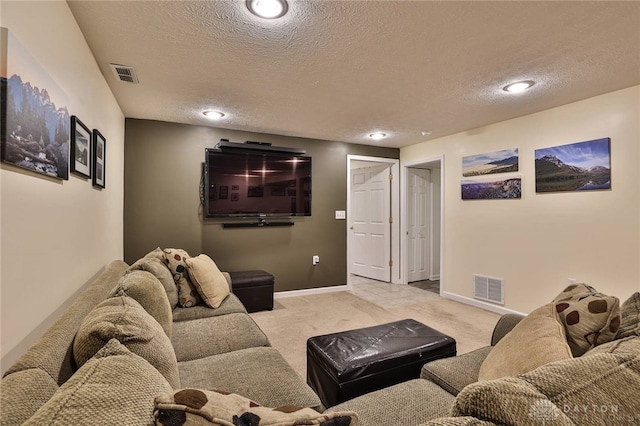 living room with visible vents, baseboards, and carpet