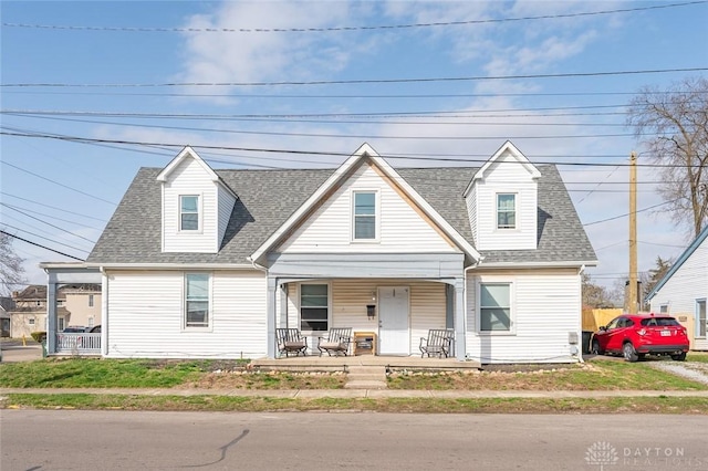 131 S Mulberry St, Troy, OH 45373 - new england style home with a porch and a shingled roof