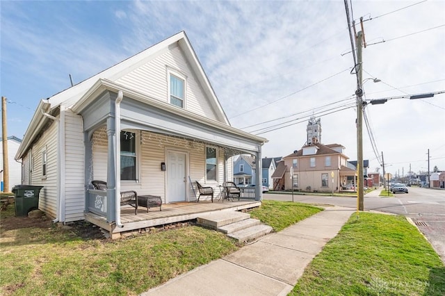 131 S Mulberry St, Troy, OH 45373 - view of front facade with a front lawn and a porch