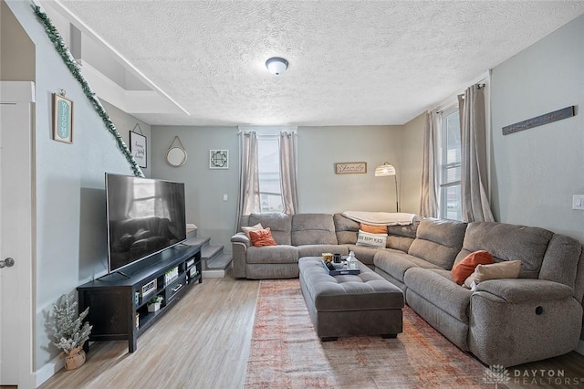 131 S Mulberry St, Troy, OH 45373 - living room with wood finished floors, plenty of natural light, and a textured ceiling